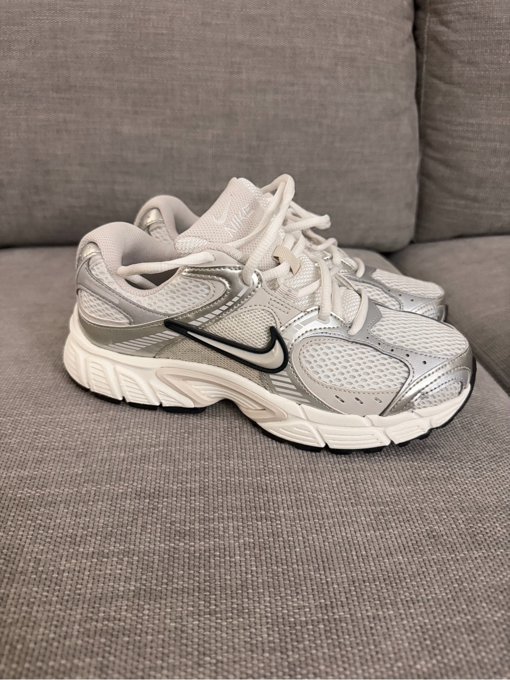 Nike Kids White and Silver Athletic Sneakers with Black Swoosh